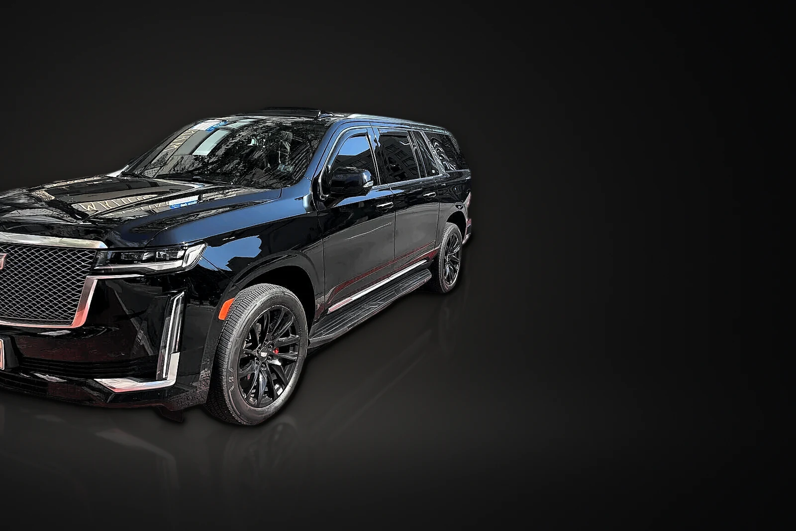 Black Cadillac Escalade ESV, front three-quarter view