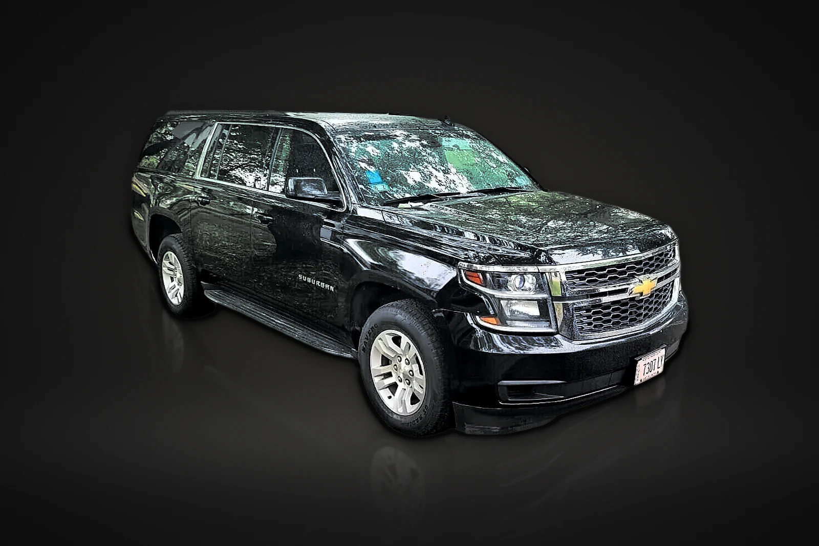 Black Chevrolet Suburban, front three-quarter view