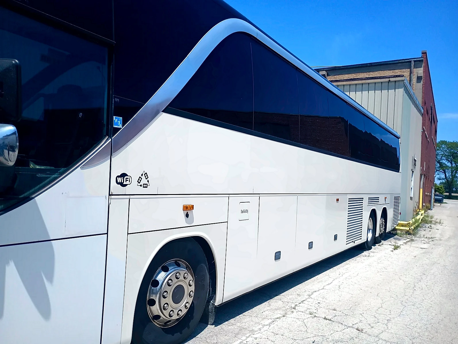White Setra motor coach in side profile